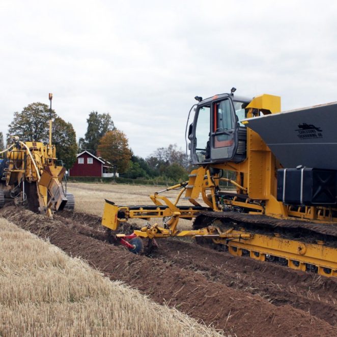 Installing a drainage system next to a field